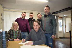 Representatives from Witney Town Council and the Witney Music Festival sign the partnership agreement