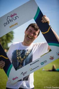 Cllr Enright with the Parkrun selfie frame