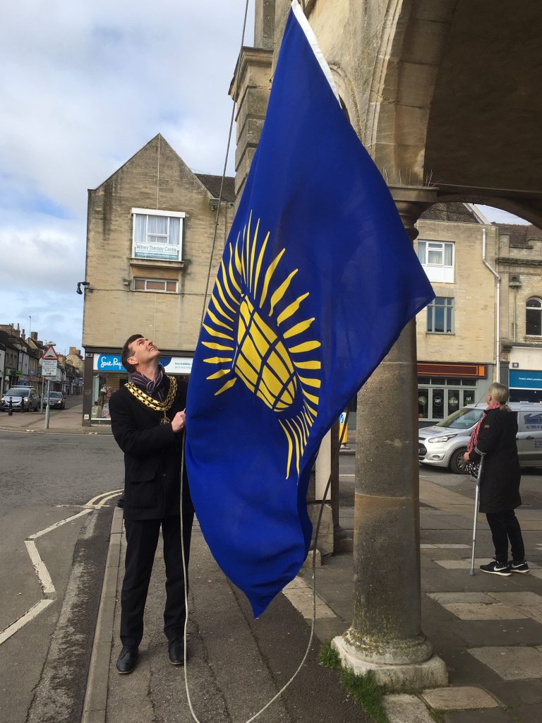 The Mayor raising the Commonwealth Flag