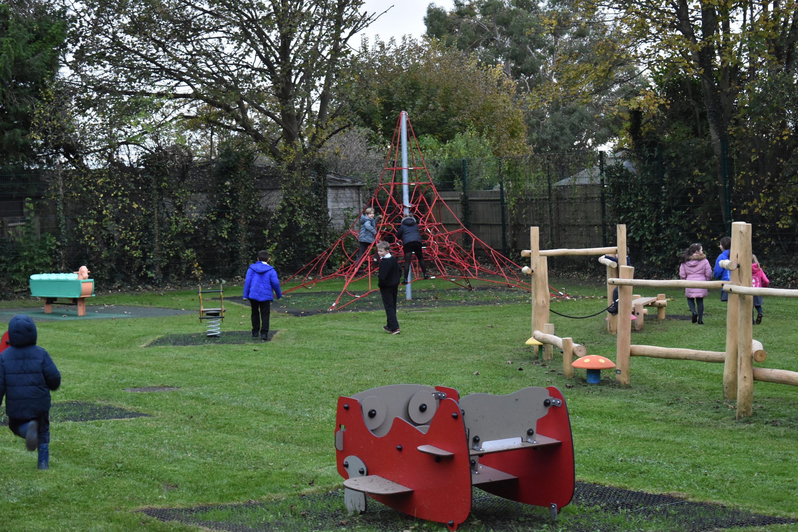 Children using the play equipment in the new park