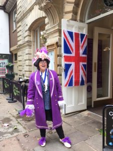 Female Town Crier in purple regalia