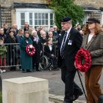 Representatives lay a wreath