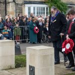 Representatives lay a wreath