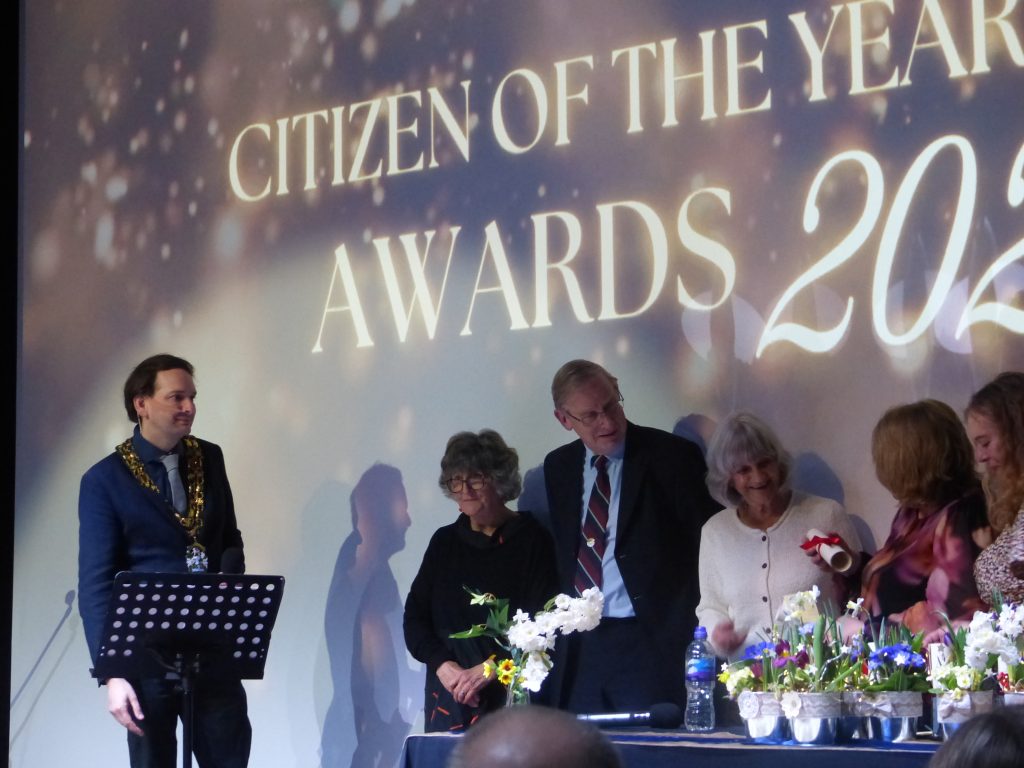 A group of award winners on stage