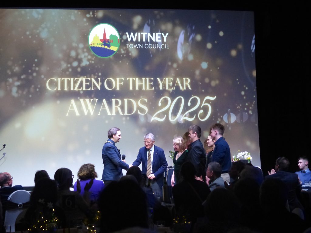 A group of people accepting an award