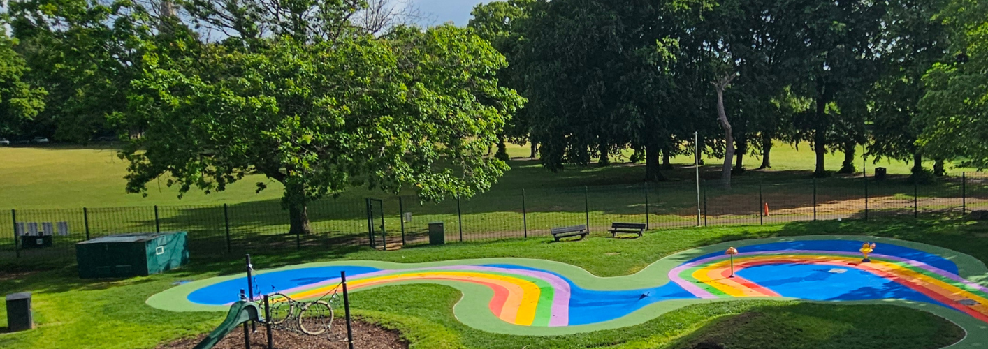 Rainbow coloured splash pads at the Leys park